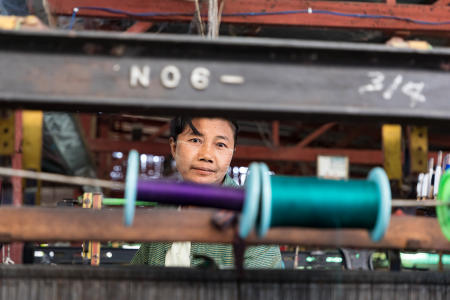 Worker at a weaving factory