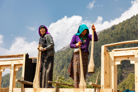 Building the walls on a rammed earth house