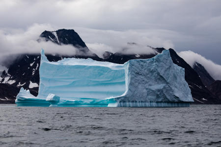 Iceberg and coastline, Ammassalik Fjord, East Greenland